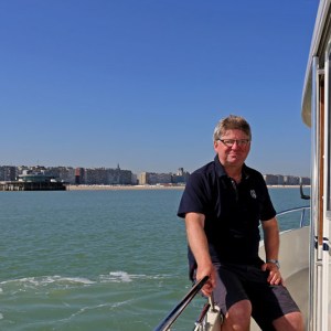 a man standing on a boat in the water