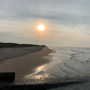 a sunset over a body of water