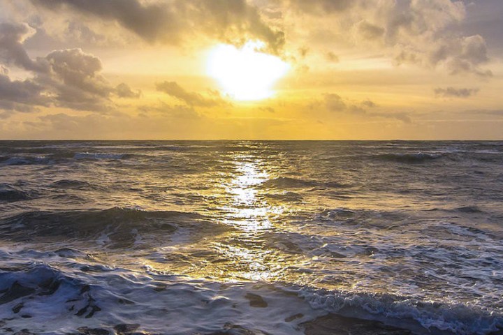 a sunset over a body of water