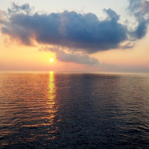 a sunset over a body of water