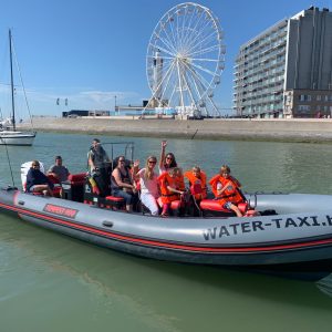 a group of people on a boat in the water