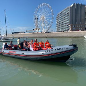 a group of people on a boat in the water