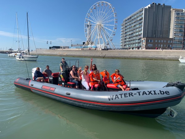 a group of people on a boat in the water